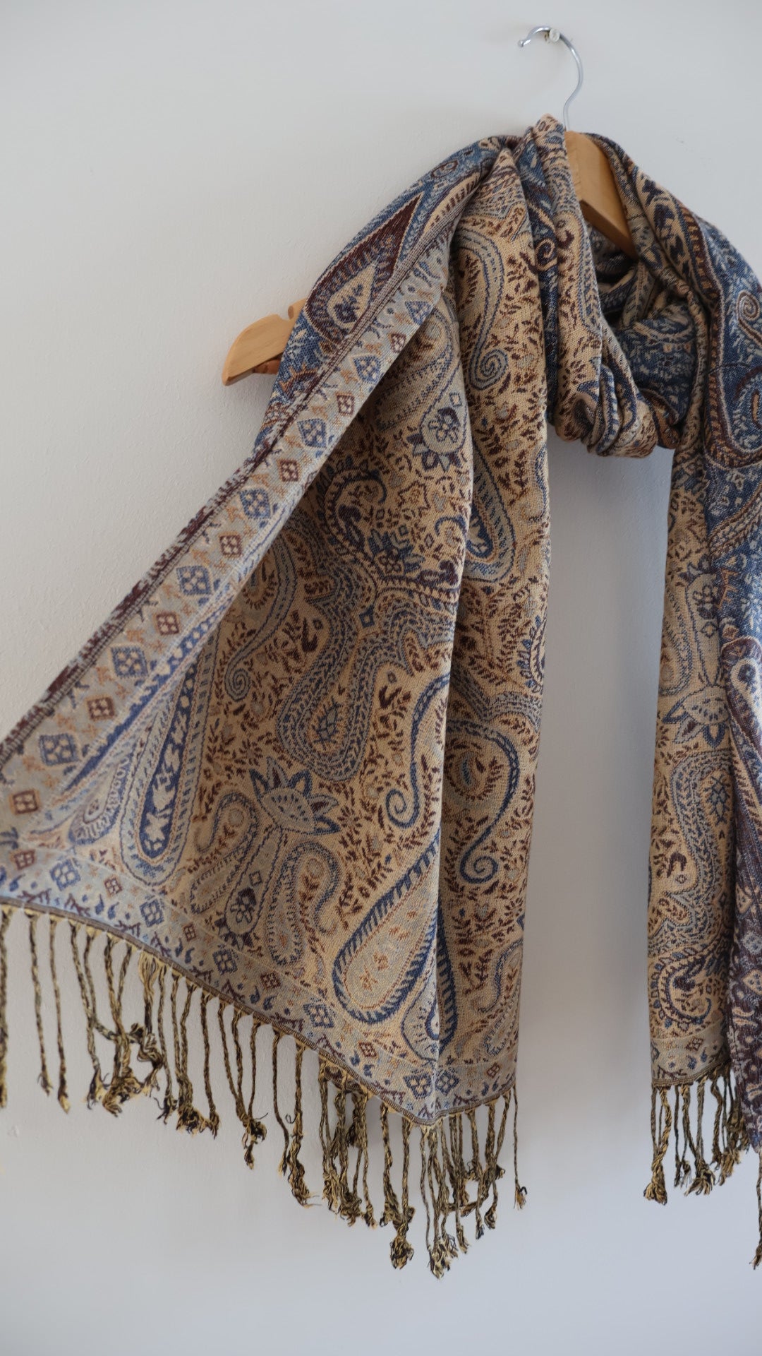 Blue Maroon boho festival pashmina scarf draped on a hanger, side 2.