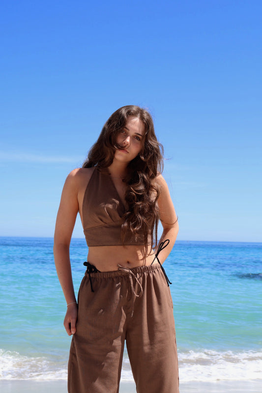 Dark brown linen pants with straight-leg fit and side pockets, perfect for daily wear