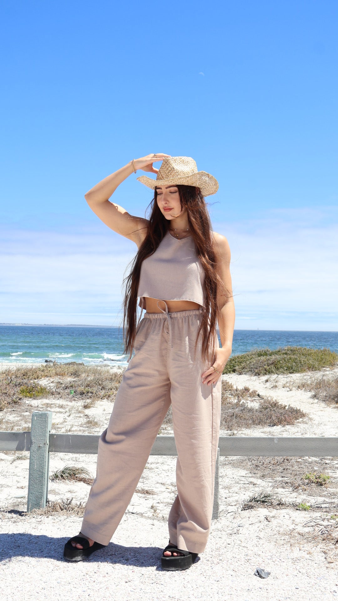 Light brown linen pants for women made from breathable fabric with a relaxed fit