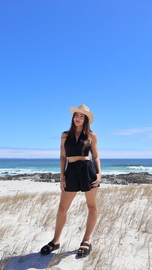 Soft women’s linen shorts with relaxed fit, styled with a linen halter wrap top.