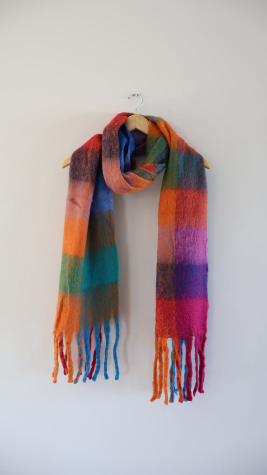 Chunky knit winter scarf in bright, colourful tones with oversized design for warmth and comfort

