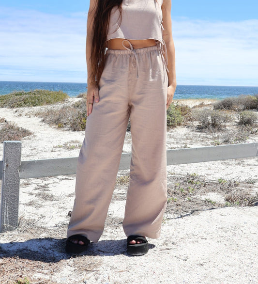 Light brown linen pants for women made from breathable fabric with a relaxed fit