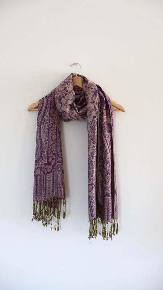 Purple boho festival pashmina scarf draped on a hanger