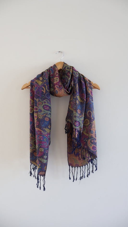 Purple Blue boho festival pashmina scarf draped on a hanger
